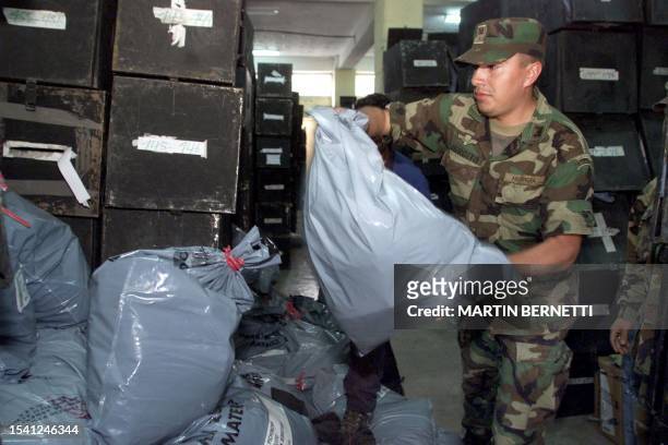 Equadorian soldier stashes a bags with electoral ballots in Quito, Ecuador, 21 October 2002. Gutiérrez and banana tycoon Alvaro Noboa are set to...