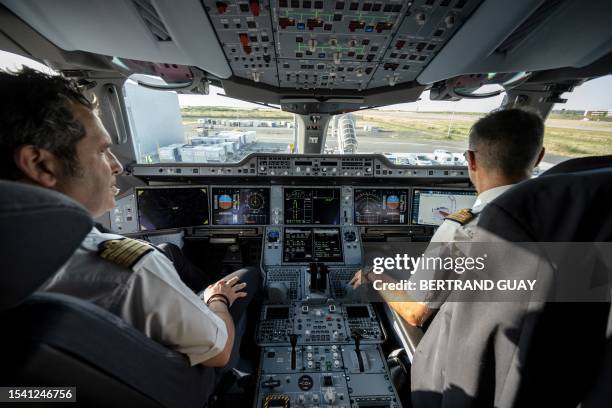 This picture taken on July 18 shows the cockpit of the new Air France Airbus A350 airplane at the Roissy-Charles-de-Gaulle airport in...