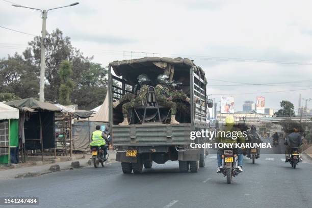 Kenyan security officers patrol along Jogoo road as they keep watch in anticipation of anti-government protests in Nairobi on July 19, 2023. Kenya...