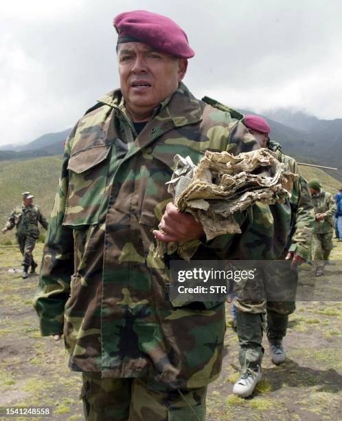 Ecuadoran Col. Juan Carlos Vergara , at the foot of Mount Chimborazo, 130kms south of Quito, carries a newspaper 18 February reportedly recovered...