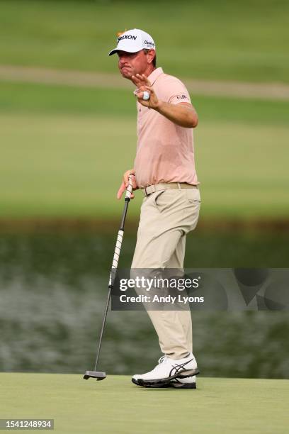 Lucas Glover of the United States reacts to his putt on the 18th hole during the first round of the Barbasol Championship at Keene Trace Golf Club on...