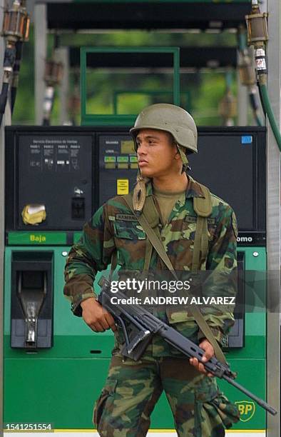 Venezuelan soldier patrols a gas station in Maracaibo, 19 December 2002, as the country enters the 18th day of a general strike instigated by the...