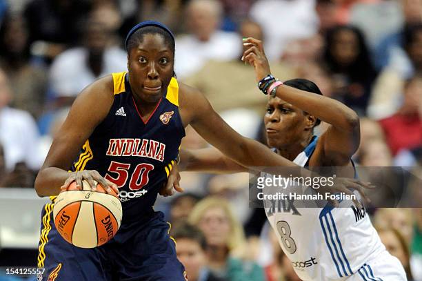 Taj McWilliams-Franklin of the Minnesota Lynx defends against Jessica Davenport of the Indiana Fever during the second quarter in Game One of the...