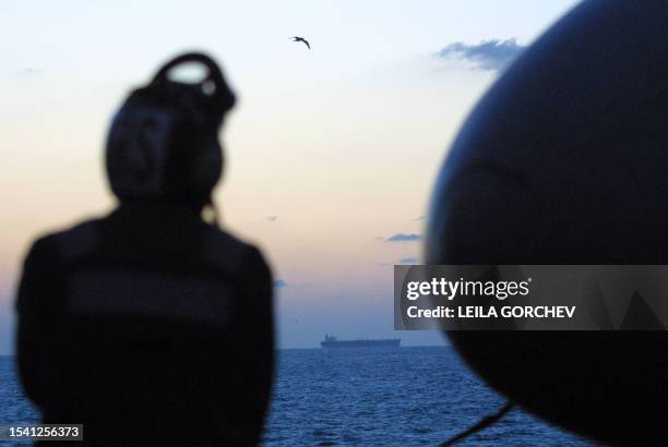 An oil tanker is visible from the USS Constellation 23 December 2002 in the Gulf. The USS Constellation is conducting operations to help enforce the...