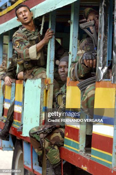 Soldiers of the Colombian military are transported on a public bus towards the zone where a masacre took place in the municipality of San Carlos,...