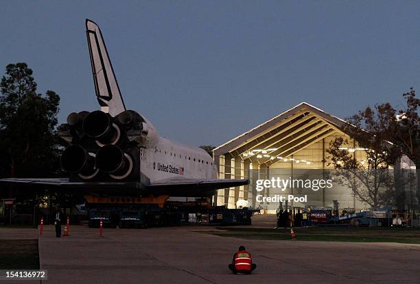 The Space Shuttle Endeavour is moved into the hangar in the California Science Center on October 14, 2012 in Los Angeles, California. Endeavour is on...