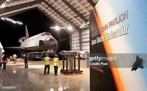 The Space Shuttle Endeavour is moved into the Samuel Oschin Pavilion hangar in the California Science Center on October 14, 2012 in Los Angeles,...