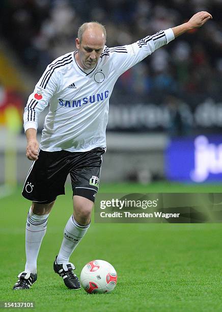 Mario Basler of Germany runs with the ball during the century match between Germany and Italy at Commerzbank Arena on October 14, 2012 in Frankfurt...