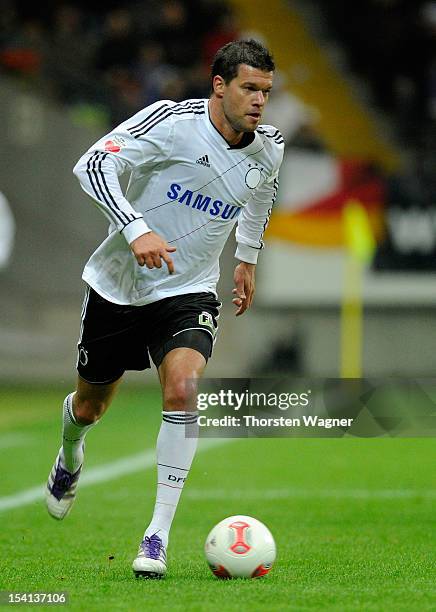 Michael Ballack of Germany runs with the ball during the century match between Germany and Italy at Commerzbank Arena on October 14, 2012 in...