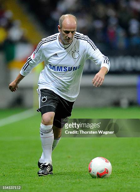 Mario Basler of Germany runs with the ball during the century match between Germany and Italy at Commerzbank Arena on October 14, 2012 in Frankfurt...