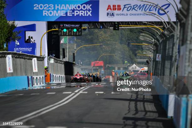 Jake Dennis of Great Britain and Avalanche Andretti, Nick Cassidy of Australia and Envision Racing and a group of riders positioned at start in race...