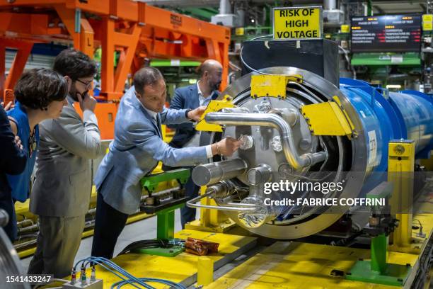 Chilean President Gabriel Boric and Chilean Minister for Science, Technology, Knowledge and Innovation of Chile Aisen Etcheverry listen to...