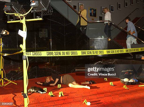 Audience members walk past a display while attending "Behind the Scenes of CSI: Crime Scene Investigation", an in-depth discussion of the television...