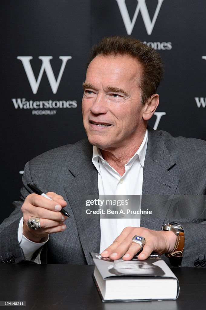 Arnold Schwarzenegger meets fans as he signs copies of his book... News