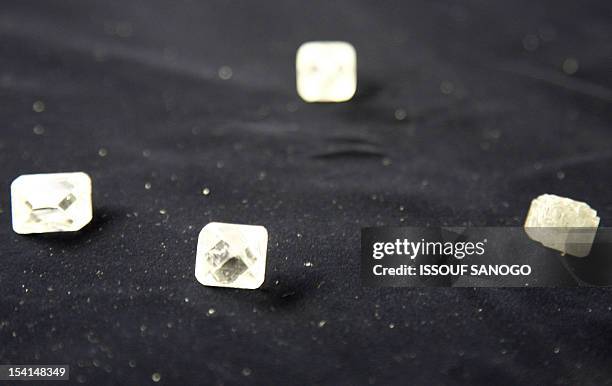 Raw diamonds are seen 10 August 2007 at Gold and Diamond department of Sierra Leone Central Bank in Freetown. The first Sierra Leonean diamond was...