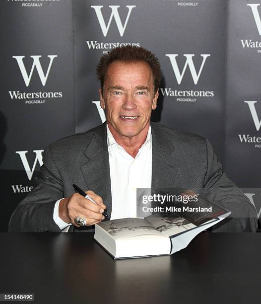 Arnold Schwarzenegger Book Signing For Total Recall Photos and Premium