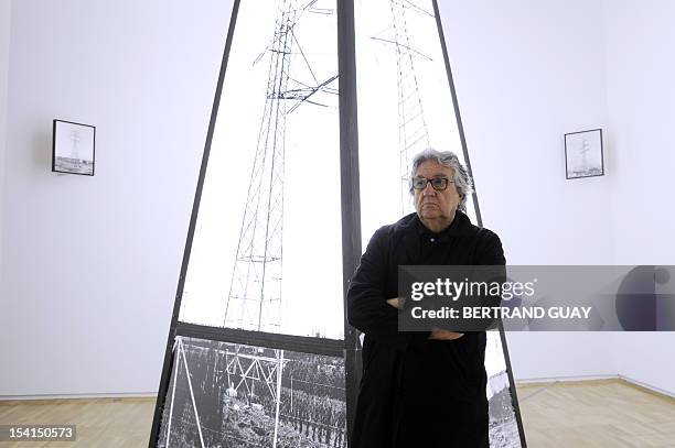 Spanish artist Antoni Muntadas poses in front of "Monumento generico", one of his installations displayed during an exhibition entitled "Between"...