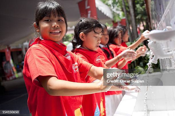 Child washes her hands with soap to celebrate Global Handwashing Day on October 15, 2012 in Jakarta, Indonesia. Celebrated in over 100 countries,...