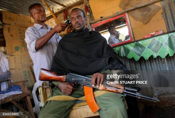 In a photograph taken and released by the African Union-United Nations Information Support Team on October 7 a fighter of the pro-government Ras...