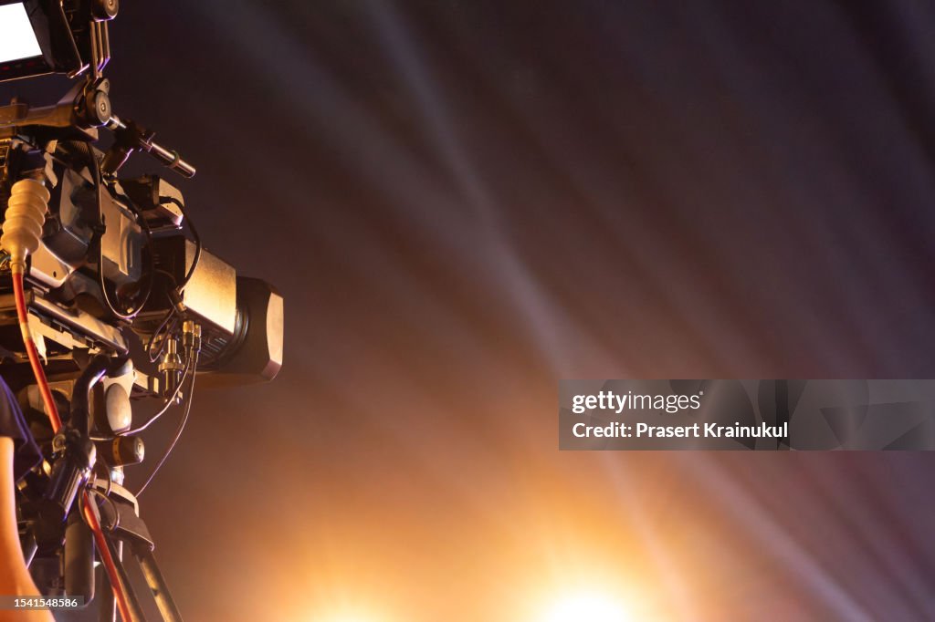 Professional digital video camera on the crane and tripod in concert