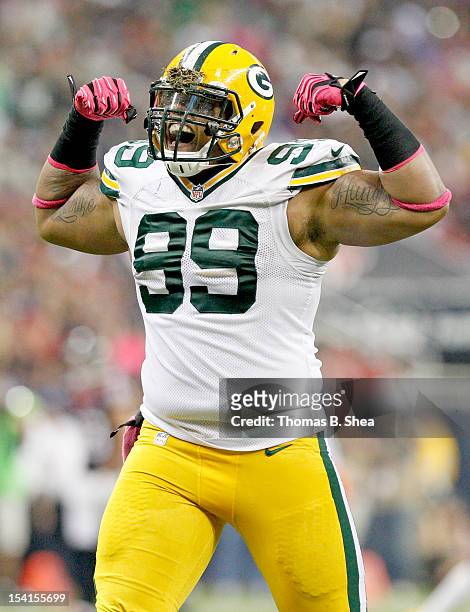 Jerel Worthy of the Green Bay Packers celebrates after sacking Matt Schaub of the Houston Texans on October 14, 2012 at Reliant Stadium in Houston,...