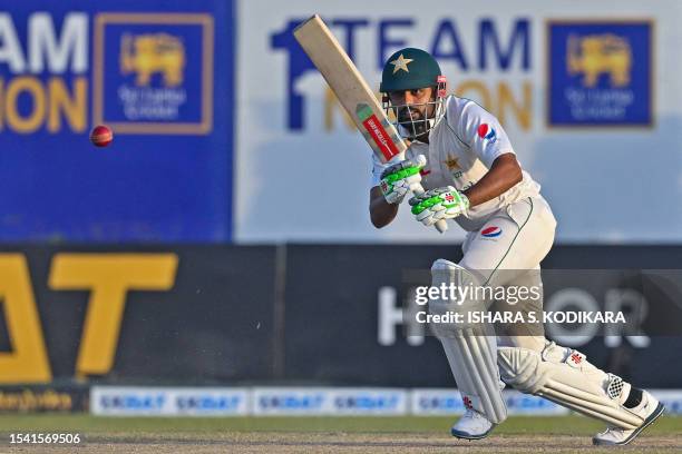 Pakistan's captain Babar Azam plays a shot during the fourth day of the first cricket Test match between Sri Lanka and Pakistan at the Galle...