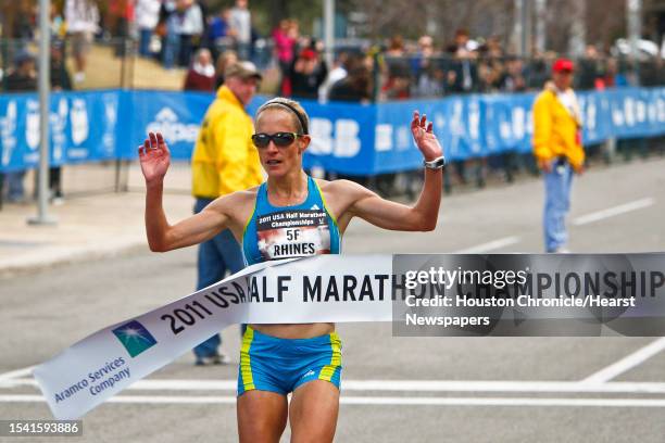 Jen Rhines crosses the finish line to win the Women's 2011 USA Half Marathon National Championships Saturday, Jan. 29 in Houston.