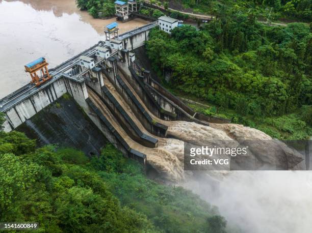 Flood water is discharged through the sluice gate of the Huatan Hydropower Station as a result of heavy rainfalls from the upstreams on July 13, 2023...
