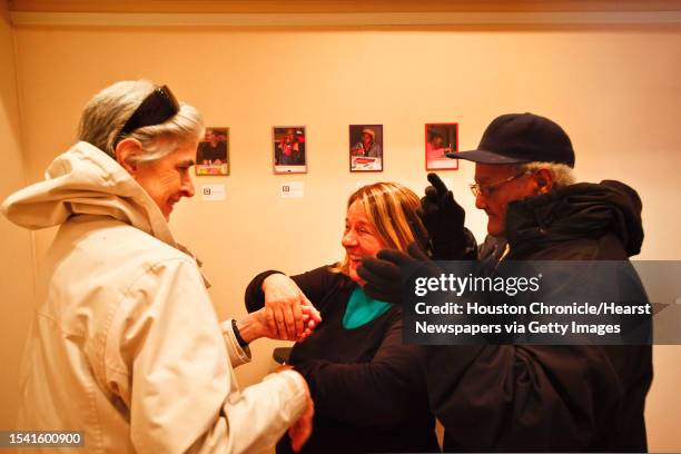 Mary Jane Dodson, both visually impaired and deaf, laughs along with Shelagh Moran , VP and COO of The Lighthouse of Houston, asBetty Telfur sings a...