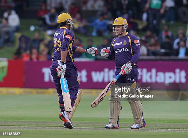 Manvinder Bisla and Brendon McCullum of the Kolkata Knight Riders celebrate during the Karbonn Smart CLT20 match between Kolkata Knight Riders and...
