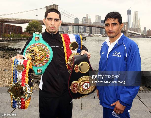 Boxers Danny Garcia and Erik Morales pose during a photo call in front of the Brooklyn Bridge on October 15, 2012 in the Brooklyn borough of New York...