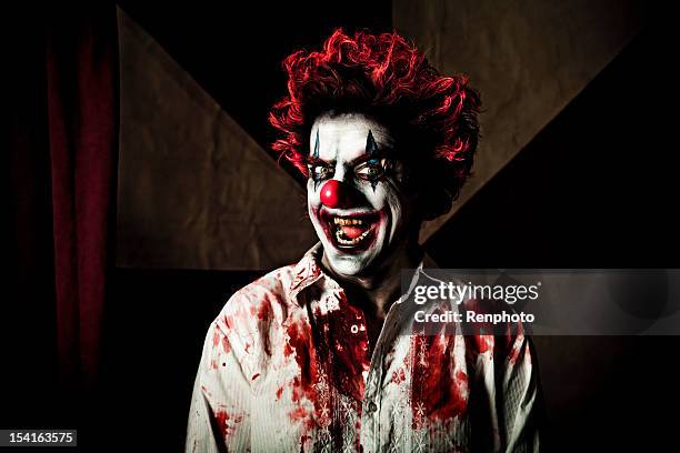 killer clown with an evil smile - killer clown stock pictures, royalty-free photos & images