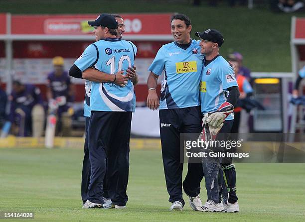 Auckland Aces team-mates celebrate during the Karbonn Smart CLT20 match between Kolkata Knight Riders and Auckland Aces at Sahara Park Newlands on...