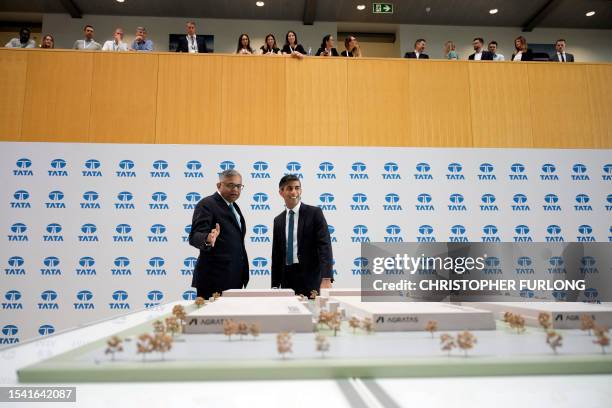 Britain's Prime Minister Rishi Sunak and Chairman of the Board at Tata, Natarajan Chandrasekaran , visit Land Rover on July 19, 2023 in Warwick,...