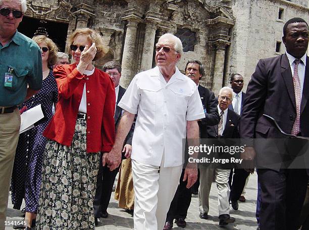 Former U.S. President Jimmy Carter and his wife Rosalin Carter walk toward the Center of Old Havana May 12, 2002 in Havana, Cuba. Carter is on a...