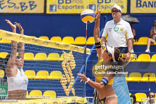 Maria Elisa Antonelli hits a return during the Women's Beach Volleyball Circuits Banco do Brasil at Centro Administrativo on October 12, 2012 in Belo...