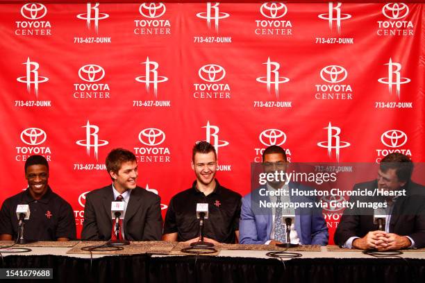 Newly acquired player, Jonny Flynn sits next to Houston Rocket's 2011 NBA Draft picks, Chandler Parsons, Donatas Motiejunas, Marcus Morris, and head...