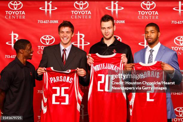 Newly acquired player, Jonny Flynn stands next to Houston Rocket's 2011 NBA Draft picks, Chandler Parsons, Donatas Motiejunas, and Marcus Morris...