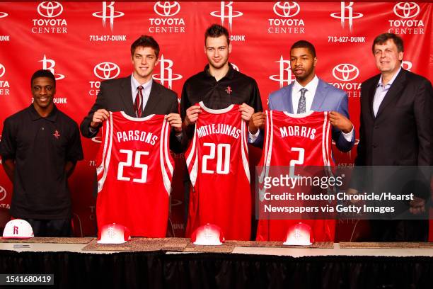 Newly acquired player, Jonny Flynn stands next to Houston Rocket's 2011 NBA Draft picks, Chandler Parsons, Donatas Motiejunas, Marcus Morris and head...