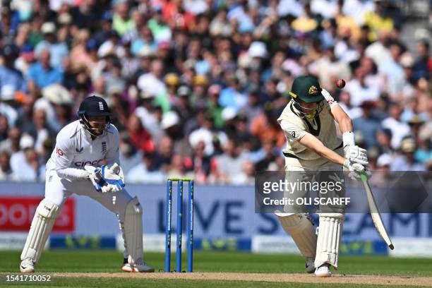 Australia's Marnus Labuschagne fails to connect with this ball from England's Moeen Ali, England's Jonny Bairstow takes a catch but there was no bat...
