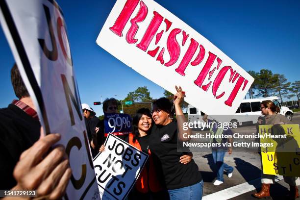Martina Grifaldo gives a hug to Maria Xiguin as they and other supporters gather at Green Rd. & JFK Blvd at the entrance to Bush IAH Airport to...