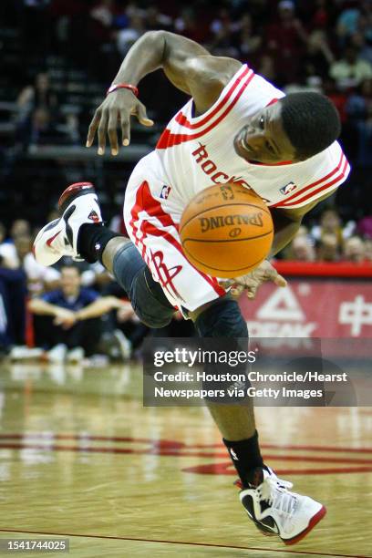 Houston Rockets point guard Jonny Flynn dribbles the ball after running into a Oklahoma City Thunder defender during the Houston Rockets vs. Oklahoma...