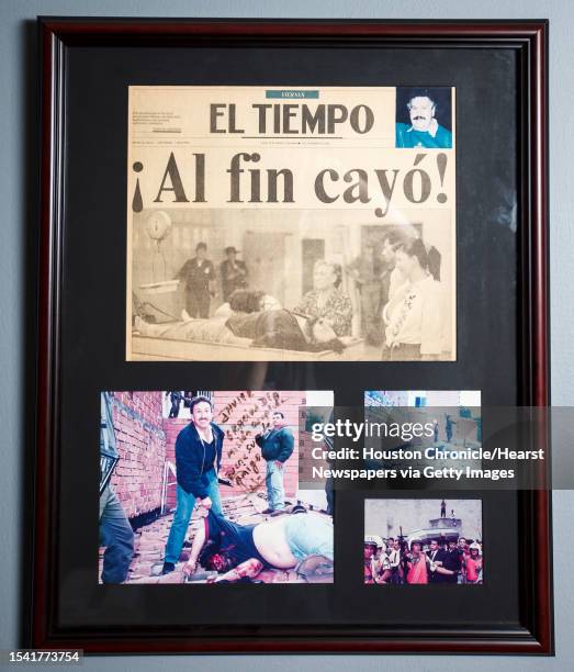 Collection of photographs and original newspaper clipping of Pablo Escobar, one of the world's most famous drug traffickers, are photographed in...