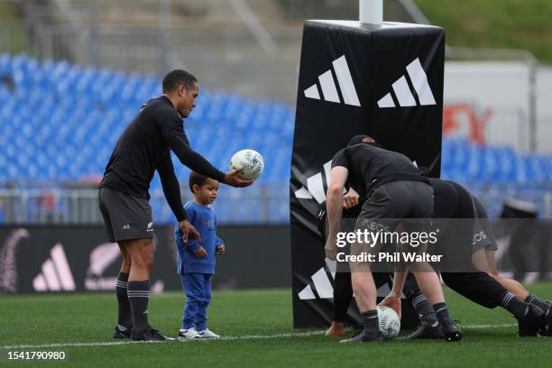 Aaron Smith of the All Blacks with his son Luka during the All Blacks Captains Run at Mt Smart Stadium on July 14, 2023 in Auckland, New Zealand.