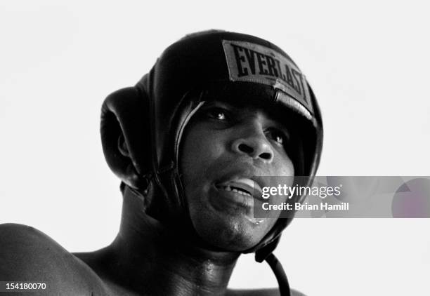 American heavyweight boxer Muhammad Ali, in protective headgear, during training at the 5th Street Gym, Miami, Florida, 1971. Ali was in training for...