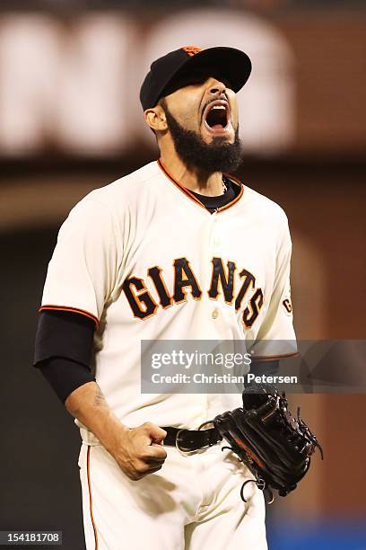 Sergio Romo of the San Francisco Giants celebrates their 7 to 1 win over the St. Louis Cardinals in Game Two of the National League Championship...