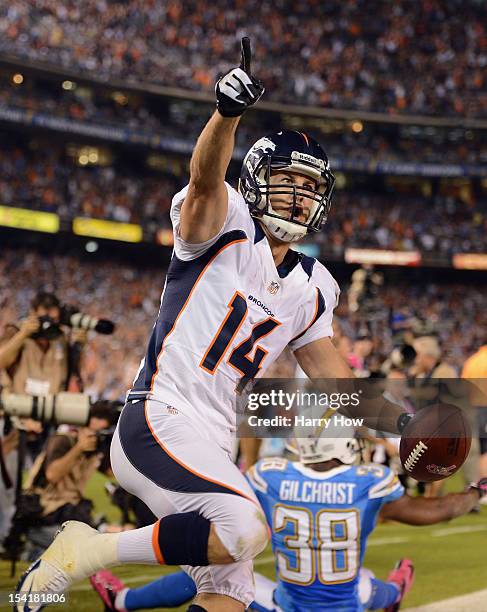 Brandon Stokley of the Denver Broncos celebrates his touchdown in the fourth quarter as Marcus Gilchrist of the San Diego Chargers looks on during...