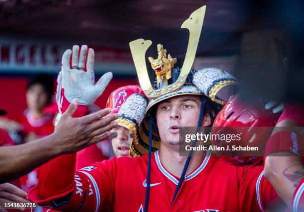 Anaheim, CA Angels center fielder Mickey Moniak is congratulated in the dugout after hitting a two-run home run in the first inning against the...