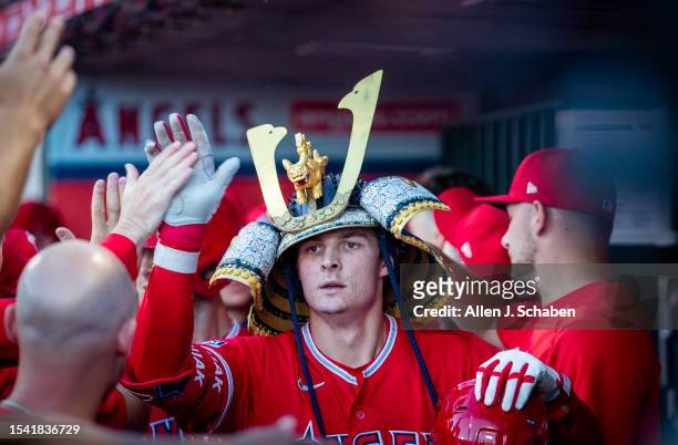 Anaheim, CA Angels center fielder Mickey Moniak is congratulated in the dugout after hitting a two-run home run in the first inning against the...