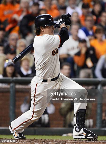 Ryan Theriot of the San Francisco Giants hits a two-run single driving in Gregor Blanco and Aubrey Huff in the eighth inning of Game Two of the...